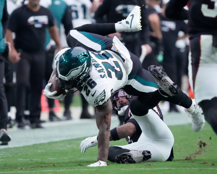 Oct 9, 2022; Glendale, Arizona, U.S.; Philadelphia Eagles running back Miles Sanders (26) is tackled by Arizona Cardinals cornerback Byron Murphy Jr. (7) after a catch during the third quarter at State Farm Stadium. Nfl Eagles